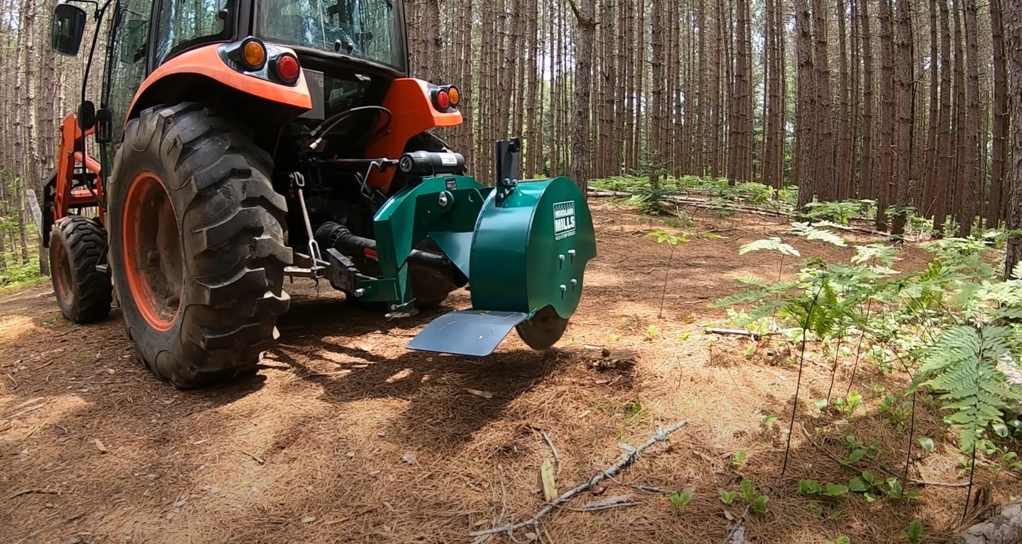 Professional stump grinding equipment operating in forested area near Menifee CA